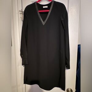 Black silk V-neck long sleeved Vince dress with leather trim at neck.